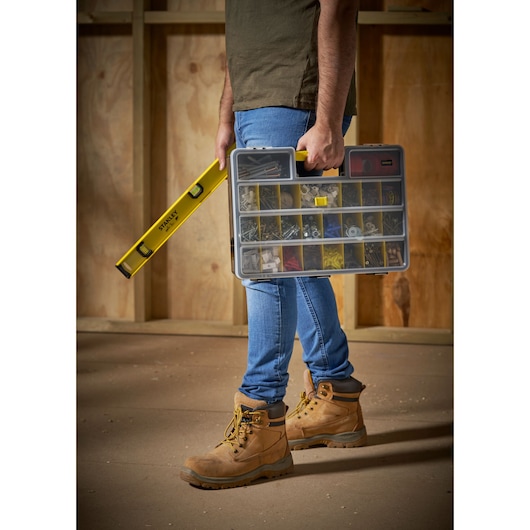 STANLEY 1-92-762 organizer box with yellow handle, held beside a yellow level, photo of person standing.
