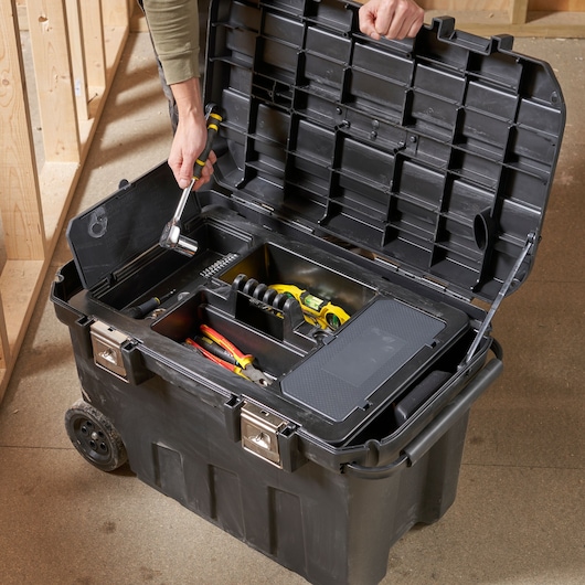 STANLEY 1-92-978 rolling tool chest with opened lid, showing organized tools inside, angled front view.
