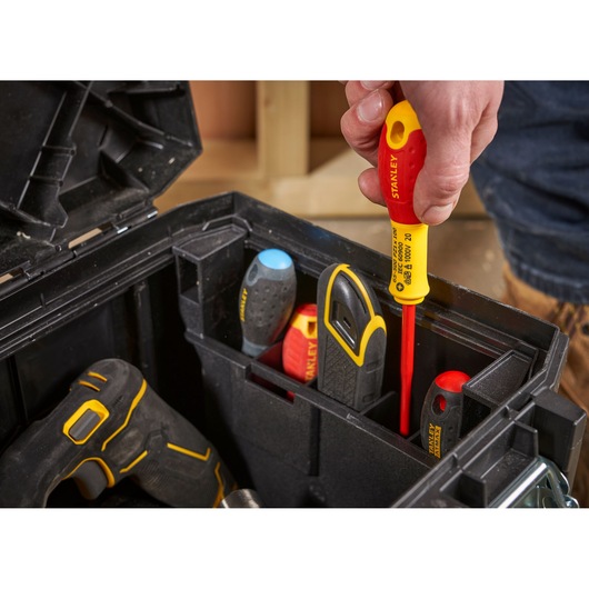 Photo of STANLEY 1-95-616 tool box with various hand tools, including screwdrivers and utility knife, in organized compartments.