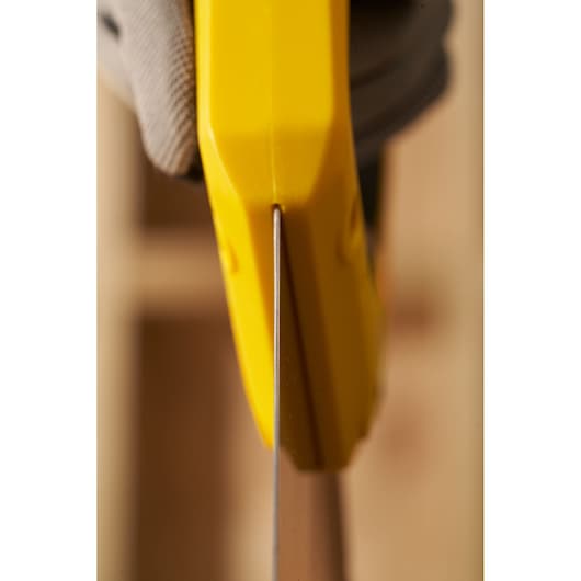 Photo of STANLEY 2-15-599 saw handle in yellow, close-up from above, showing blade alignment.