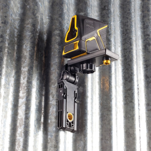STANLEY FMHT1-77348 black and yellow laser level mounted on adjustable bracket, side angle photo.