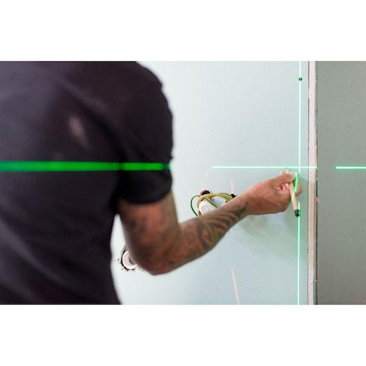 STANLEY FMHT1-77348 green laser lines used for marking on wall, photography product application.
