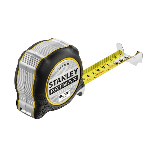 STANLEY FMHT38218-5 tape measure with yellow blade and black, silver, yellow case, side angle on white background.
