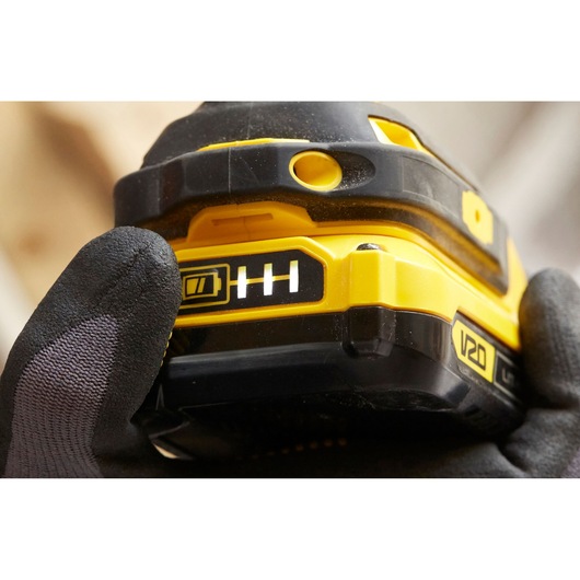Close-up photo of STANLEY SFMCF800C2K tool battery pack with V20 label and battery indicator in use.