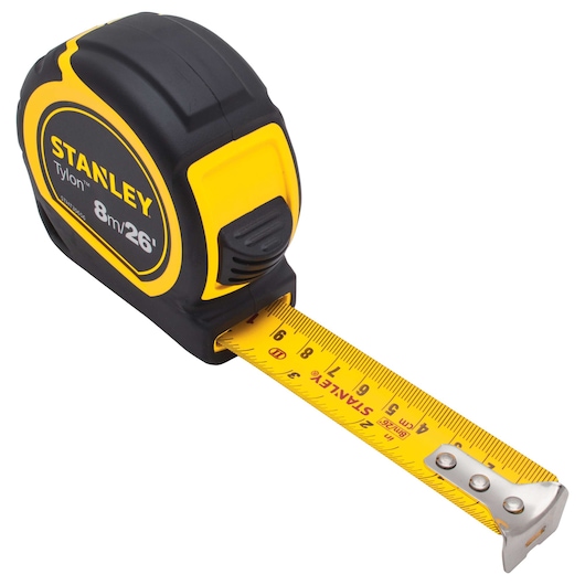 Stanley tape measure with yellow blade, 8m/26ft, angled view on white background