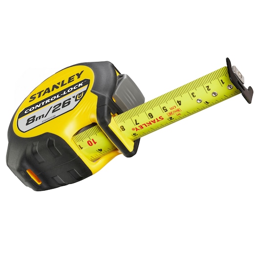 Photo of STANLEY STHT37236-5 tape measure, yellow and black, 8m/26ft, angled view on white background.