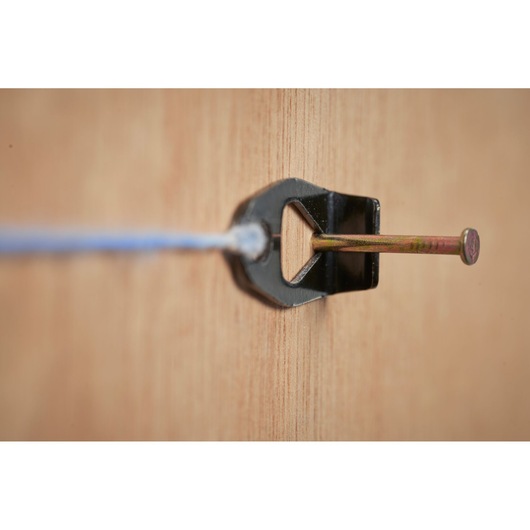 STANLEY STHT47110-0 chalk line photo, close-up of black metal hook secured with nail on wood.