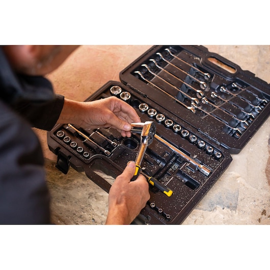 STANLEY STMT82832-1 tool set with sockets, wrenches and ratchet, photo of tools in open black case.