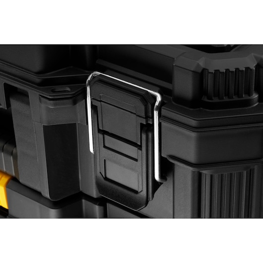 STANLEY STST83319-1 tool box latch close-up, showing black plastic and metal latch on rugged black case.